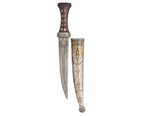 A RARE OTTOMAN SILVER-MOUNTED DAGGER, SECOND HALF OF THE 17TH CENTURY with curved double-edged crucible steel blade formed wi