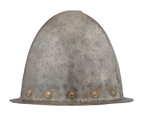 AN ITALIAN MORION IN THE 'SPANISH' FASHION, CIRCA 1590 formed in one piece with a rounded almond-shaped crown rising to a sli
