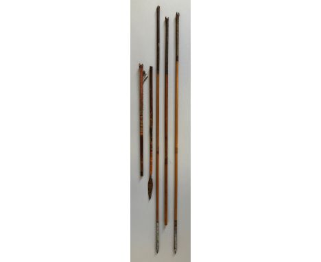 FOUR INDIAN ARROWS, 19TH CENTURY the first two with pointed iron heads tubular sockets and reed shafts, the third with leaf-s