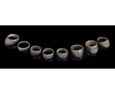 AN INDO-PERSIAN SILVER COPPER ALLOY ARCHER'S RING AND ELEVEN INDO-PERSIAN COPPER ALLOY ARCHERS' RINGS, 16TH/18TH CENTURY the 