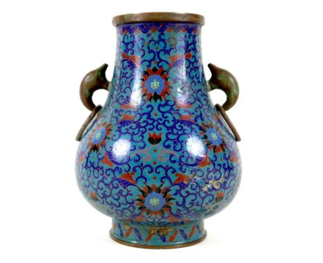 A Chinese cloisonné enamel twin handled vase, Qing Dynasty, mid to late 19th century, of Hu form, decorated in Ming style wit