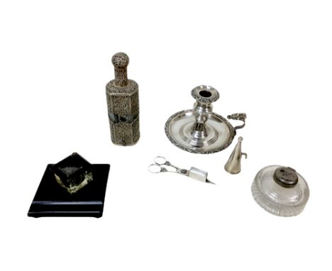 A collection of four silver plate items, comprising a chamber stick with snuffer and wick cutter with ornate floral design, a