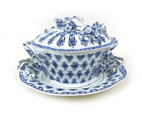 A late 18th Century Worcester chestnut basket and stand, decorated in the underglaze Pine Cone pattern, the basket of lobed s
