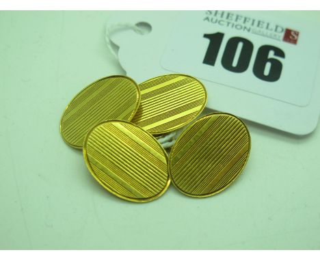 A Pair of 18ct Gold Cufflinks, the oval panels engine turned, on chain connections, Birmingham 1926 (6grams). 