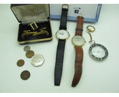 A 9ct Gold Cased Ladies Wristwatch, the signed dial with line markers, centre seconds and date aperture, on a strap; together