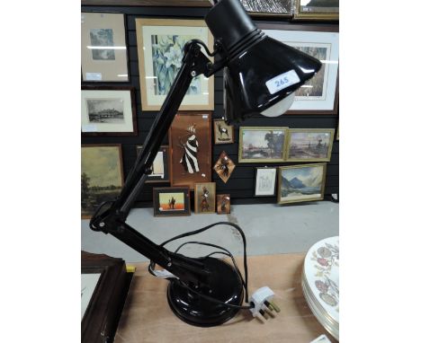 A black angle poise lamp