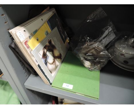 A selection of world coins and notes and vintage stamp album