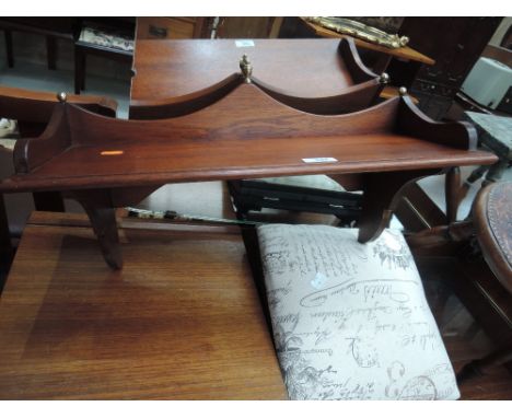 A modern mahogany wall shelf