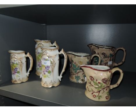 Two sets of ceramic graduated jugs