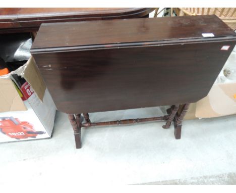 A Victorian mahogany occasional table on turned gate legs