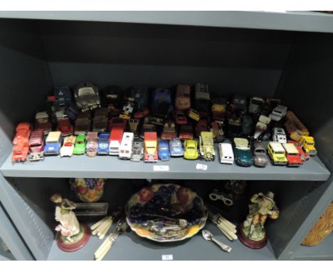 A shelf of die cast vehicles including Spectrum pursuit vehicle