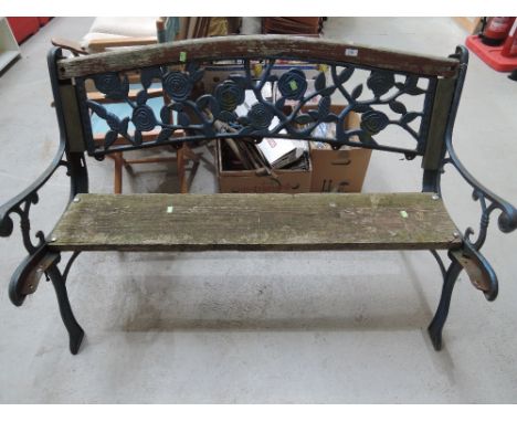 A cast iron frame garden bench