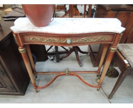 A reproduction marble top console table