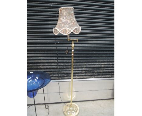 A modern brass standard lamp