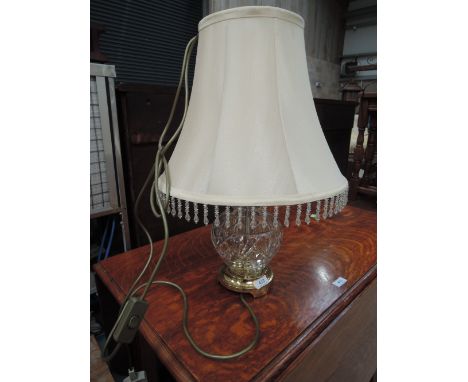 A brass and glass table lamp