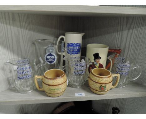 A selection of vintage branded water jugs etc