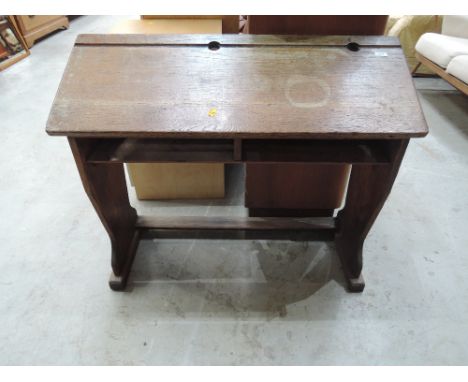 A late 19th/early 20th Century oak school desk