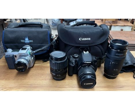 A Canon EOS 600D digital camera together with an 18-55mm lens, a 35-135mm lens and a 70-210mm lens, a carry case and a Minolt