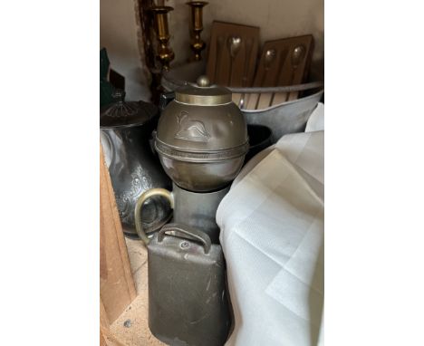 A British Empire Exhibition 1924 tea caddy together with a cow bell, pewter, brass candlesticks etc 