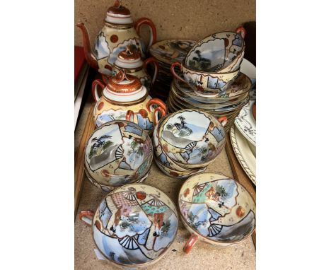 A Japanese part tea service decorated with figures in a landscape