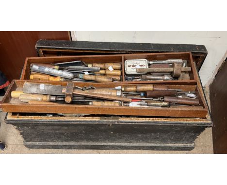 A woodworking tool chest together with a large quantity of woodworking tools