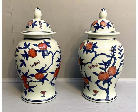VASES AND COVERS, a pair, 42cm H, glazed ceramic with fruit tree print design. 