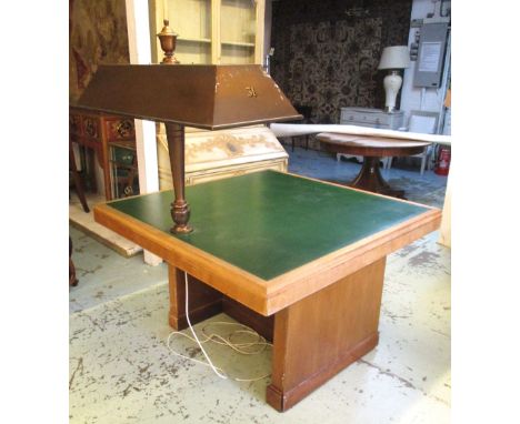 LIBRARY TABLE, Art Deco walnut with brass lamp and numbered green leather top on 'H' section pedestal, 76cm H x 122cm W x 120