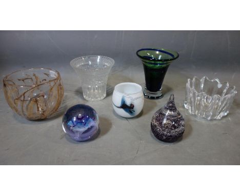 A collection of seven pieces of glassware, to include a Holmegaard glass cup, H.8cm; two glass paperweights; a hand-blown art