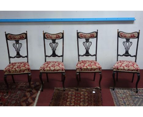 A set of four Art Nouveau dining chairs 