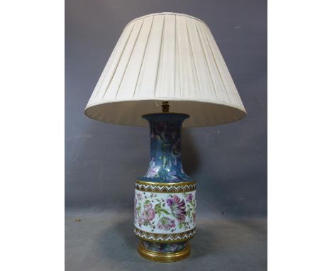 A large 20th century porcelain lamp, hand painted with flowers and gilt, possibly by Limoges, with large silk shade, H.57cm, 