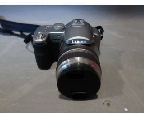 A cased Panasonic Lumix DMC-FZ30 digital camera, with 2 sim cards, 2 spare batteries and charger 