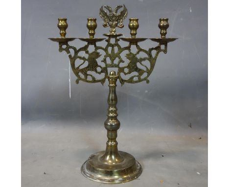 A late 19th/early 20th century Russian brass candelabra, with double headed eagle finial, H.50cm 