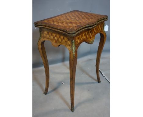 A 19th century French parquetry and kingwood card table, with ormolu mounts, raised on cabriole legs, H.75 W.79 D.55cm 