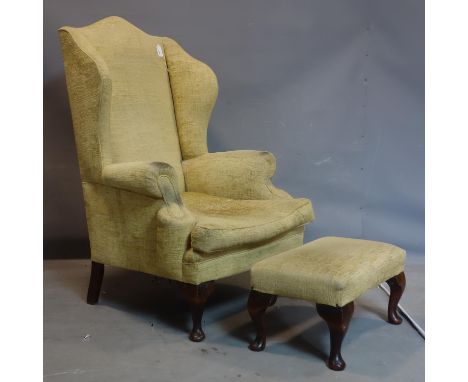 A Georgian style wing back armchair, with matching stool 