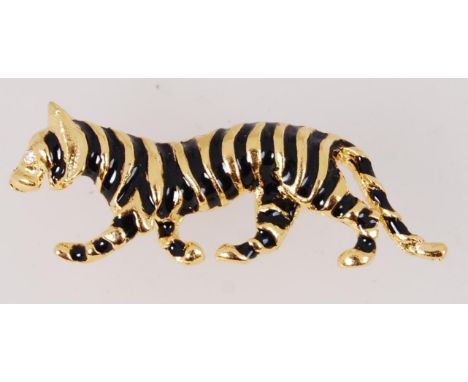 A vintage enamel Tiger brooch which is of gold tone metal with a single rhinestone. Contains roll over clasp. 5cm
