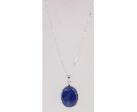 A 925 silver pendant necklace with a large lapis lazuli pendant strung on a silver chain. Total weight 34g