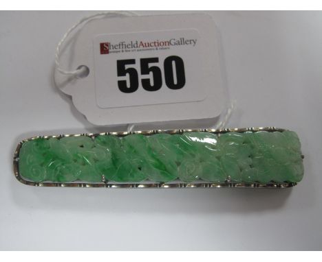 A Decorative Carved Jade Bar Brooch, of graduated pierced design, stamped "Silver" "China", overall length 7.2cm.