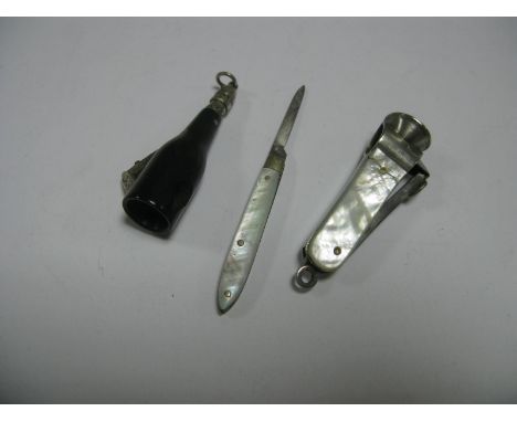 A Novelty Vintage Cigar Cutter, as a champagne bottle, stamped numbers "400089"; together with another cigar cutter with moth