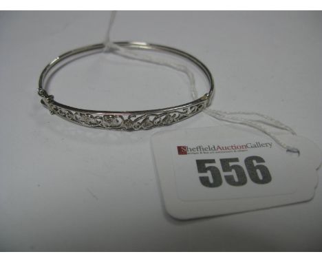 A Modern Bangle, of openwork design, stamped "DIA".