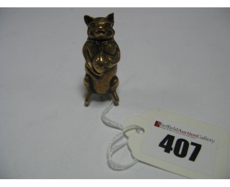A Novelty Vintage Brass Vesta Case, as a standing pig holding a sack, 4.5cm high.