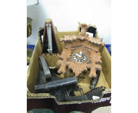 A Carved Wooden Cuckoo Clock, a Maelzel Paquet Metronome, two cased cutthroat razors and two cast iron flat irons:- One Box