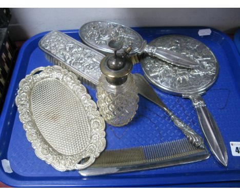 A Danish Four Piece Dressing Table Set, detailed in relief with figures in a rural setting with animals; a plated trinket tra