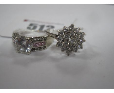 A 9ct White Gold Cluster Style Dress Ring, claw set throughout, between tapered shoulders, a 9ct white gold ornate dress ring