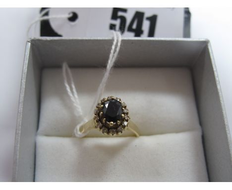 A Modern High Claw Set Cluster Dress Ring, between plain shoulders, indistinctly stamped "K18".