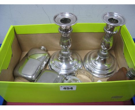 A Pair of Plated Candlesticks, each on spreading circular base (weighted), 16.3cm high; two hip flasks, a Chester hallmarked 