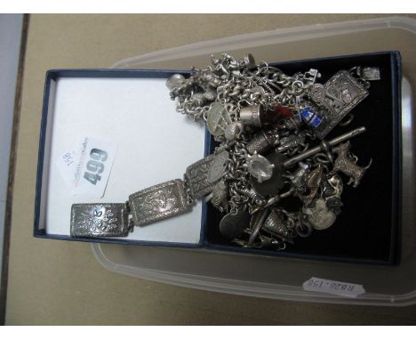 Two Curb Link Charm Bracelets, suspending numerous novelty charm pendants, assorted loose charms and a hallmarked silver pane