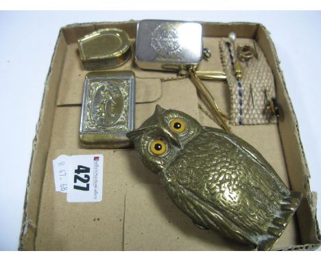 A Brass Spill Holder, as an owl with glass eyes, 10cm high, an advertising Vesta marked Harry Hall Tailor, two others with hu