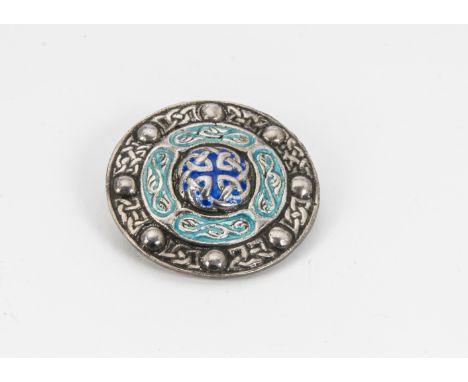 An early 20th Century silver and enamel brooch, shield shaped with Celtic motifs, Birmingham 1919 by A.H.D &amp; S, 3.8cm 