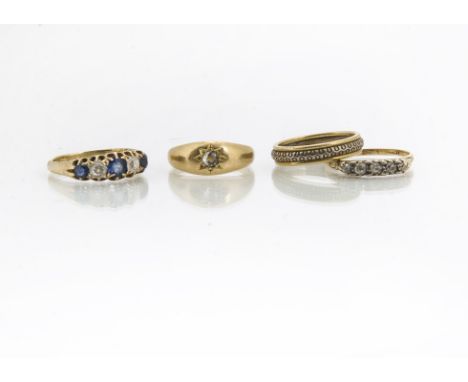 Four 18ct gold rings, comprising a five stone diamond and sapphire dress ring, approximate ring size N, a five stone diamond 