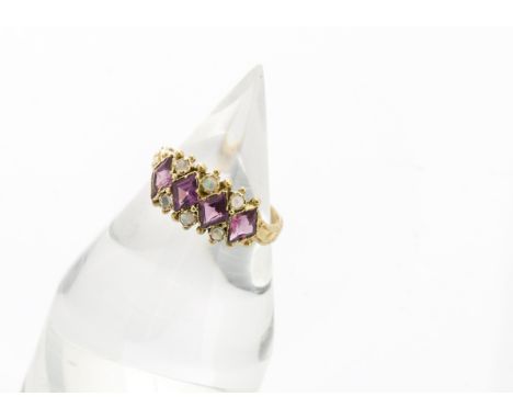 An Edwardian amethyst and opal yellow metal ring, the marquise cut amethysts alternately set with pairs of opal cabochons on 